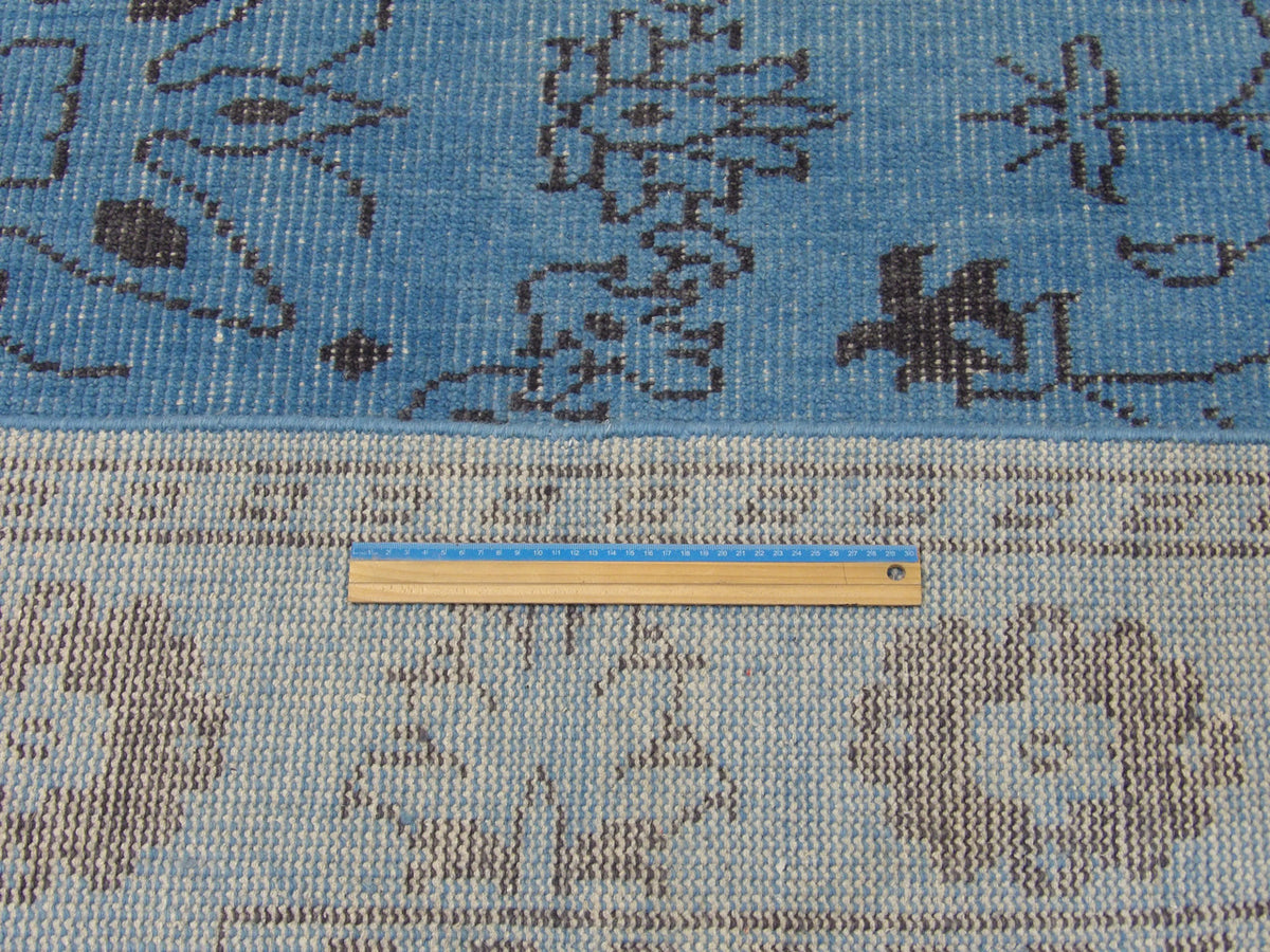 Blue & Gray Oushak Tribal Overdye rug in room setting