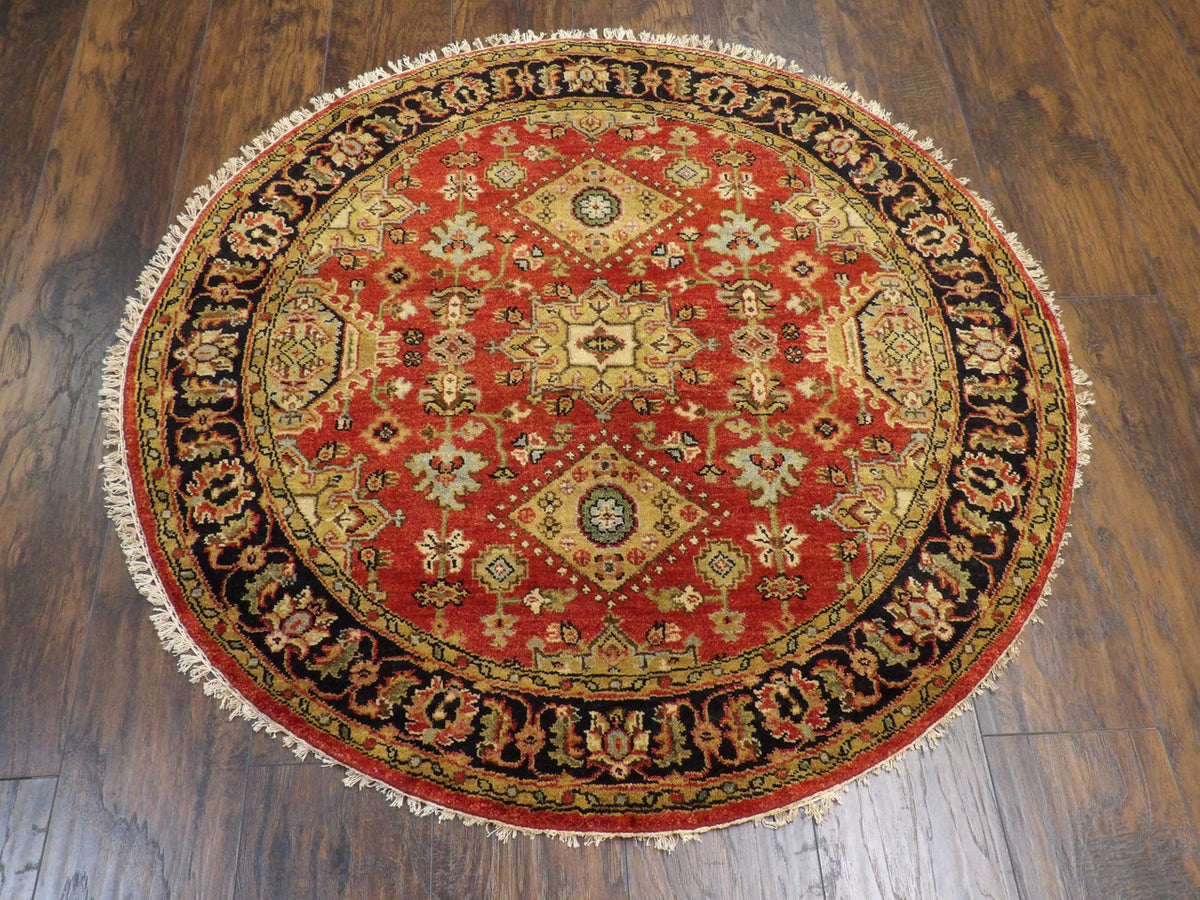 Close-up of wool pile, black and rust round rug