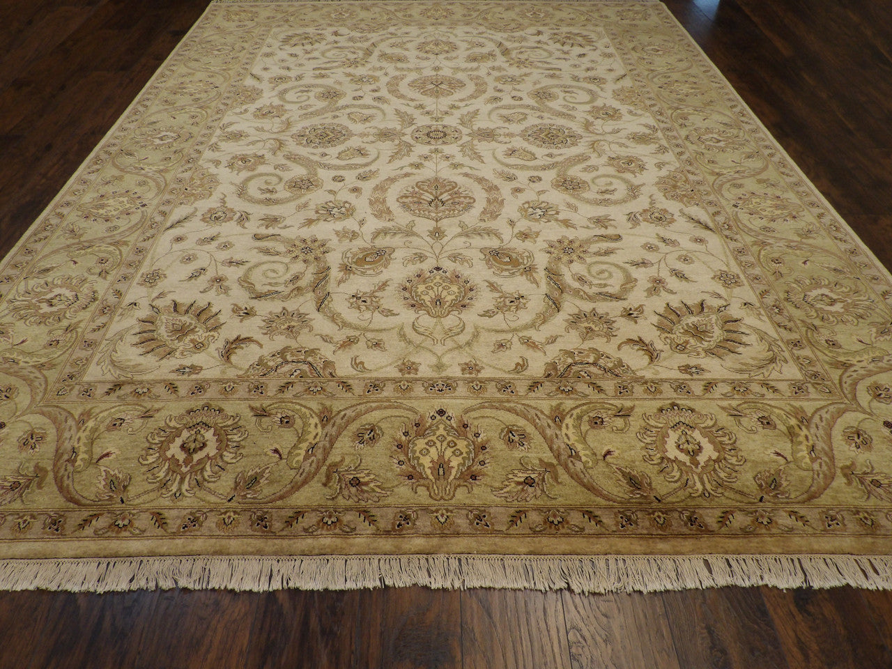 Close-up of wool pile, green and ivory rug