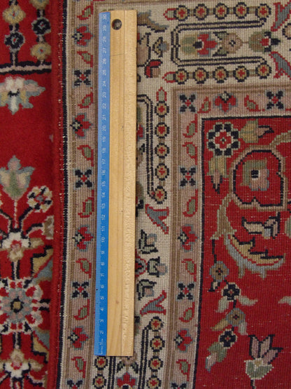 Beige & Red Persian Farahan rug in room setting