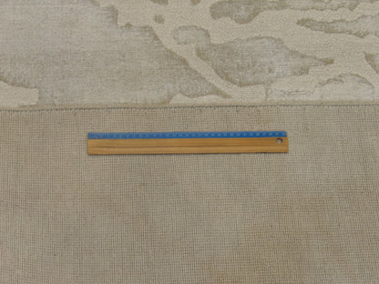 Green and gray loop abstract rug in room setting