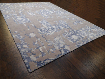 Oversized blue and white abstract rug in a great room setting