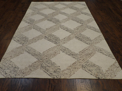 Close-up of looped wool texture, beige and brown rug