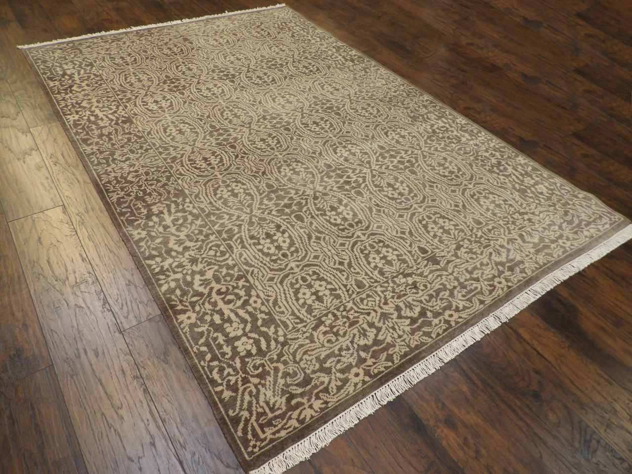 Brown and gold damask rug in a dining room setting