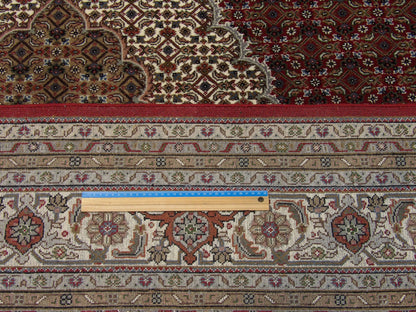 Beige & Red Fine Persian Mahi Tabriz rug in room setting
