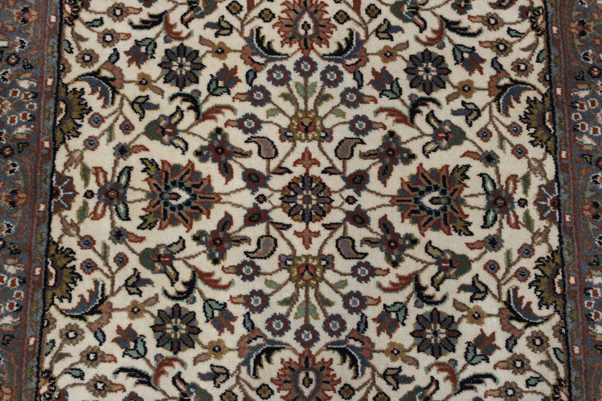 Traditional Fine Mashad rug corner detail