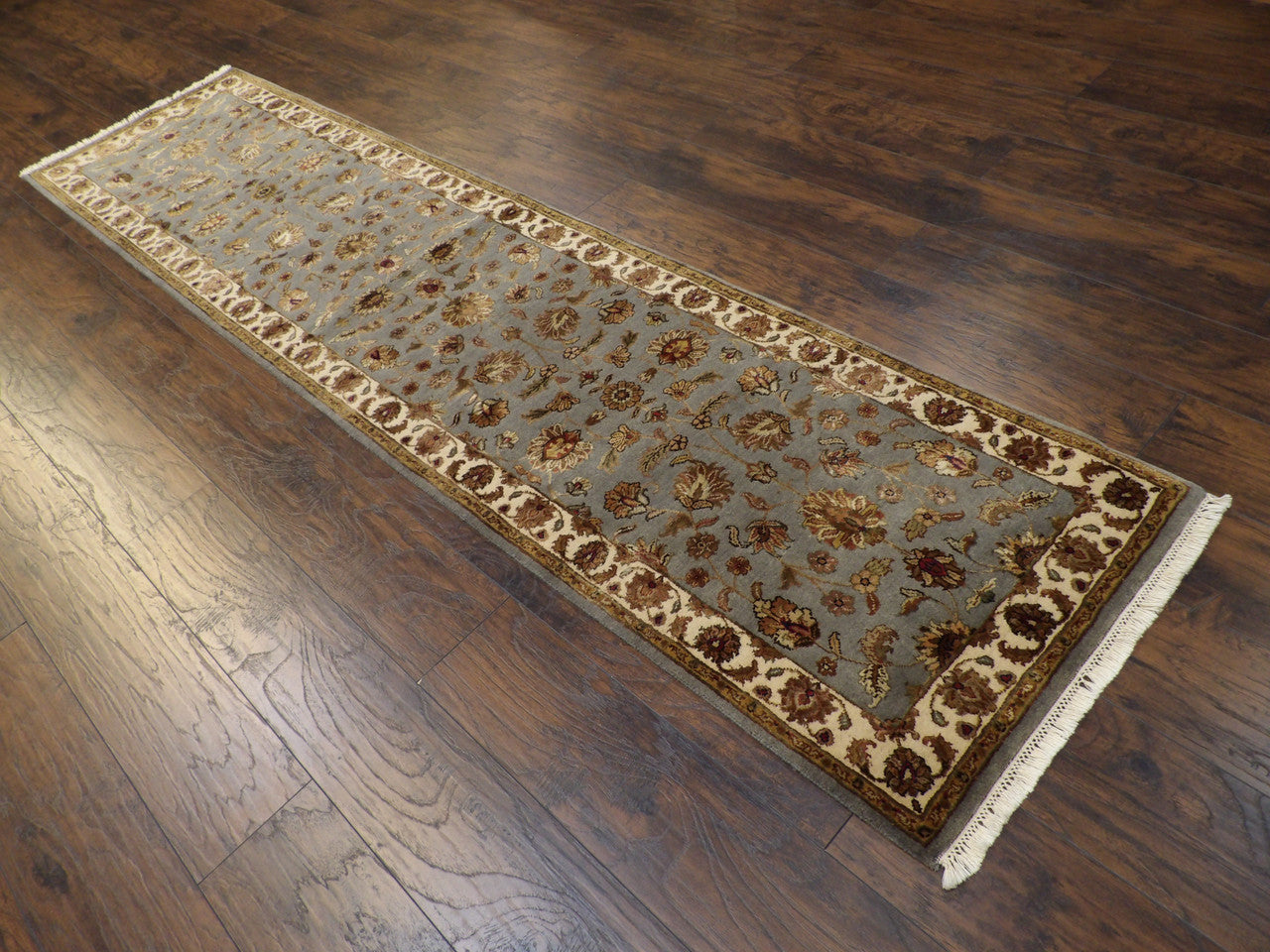Beige and blue Kashan runner in a hallway setting