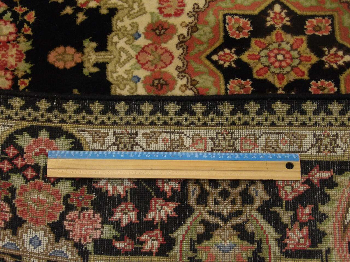 Black Fine Persian Qum rug in room setting