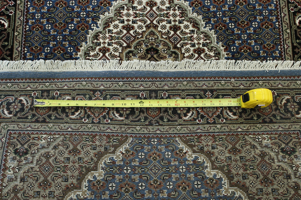 Traditional Tabriz hand-knotted wool rug in Black & Blue, full view
