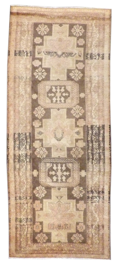 Antique Khotan hand-knotted wool runner in brown and pink, full view