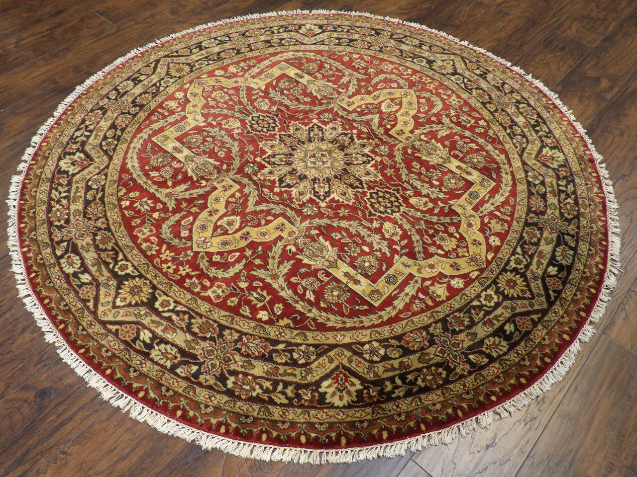 Tabriz medallion pattern detail, black and red hand-knotted rug