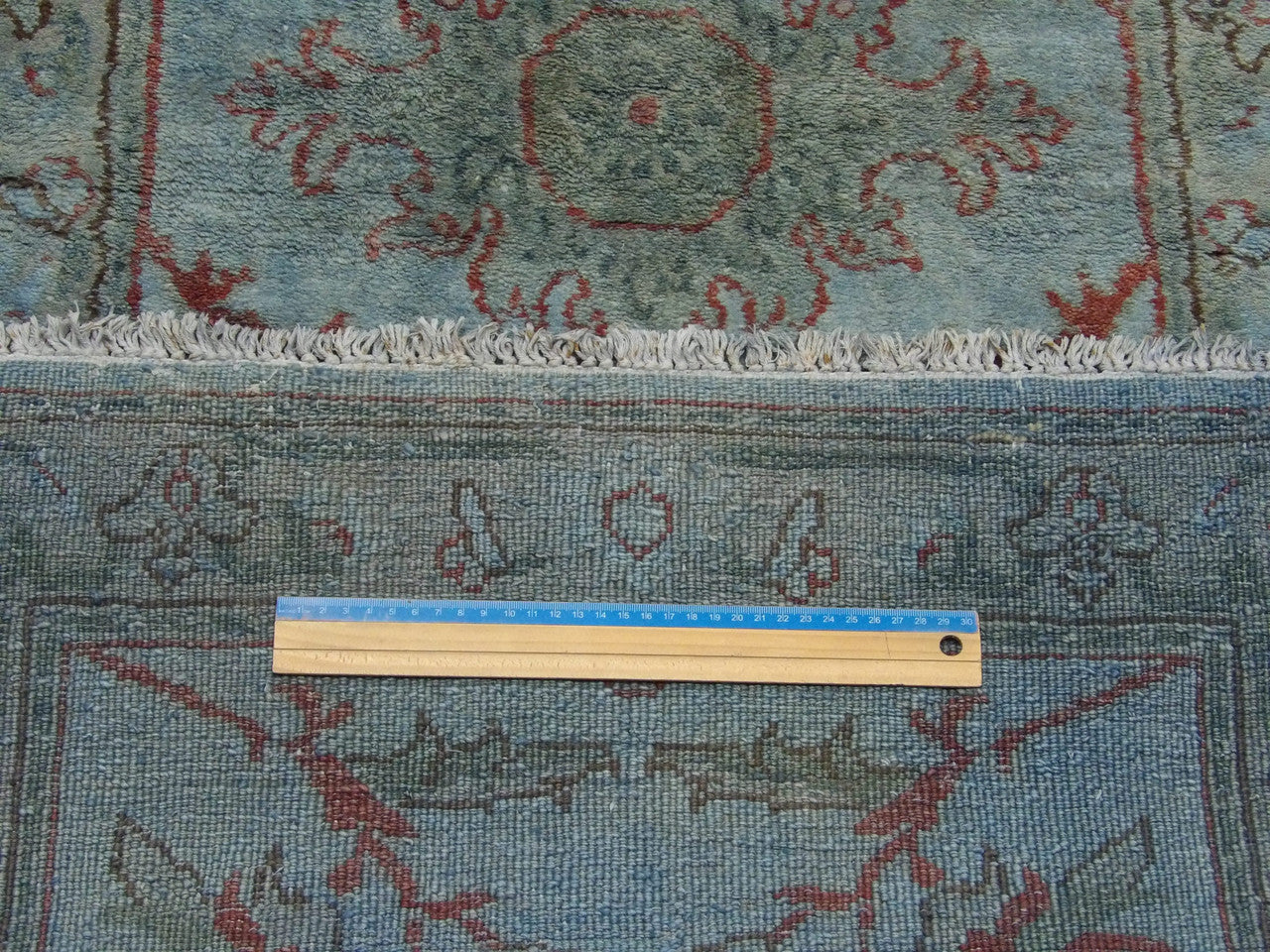 Blue Ziegler runner in hallway setting
