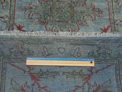 Blue Ziegler runner in hallway setting
