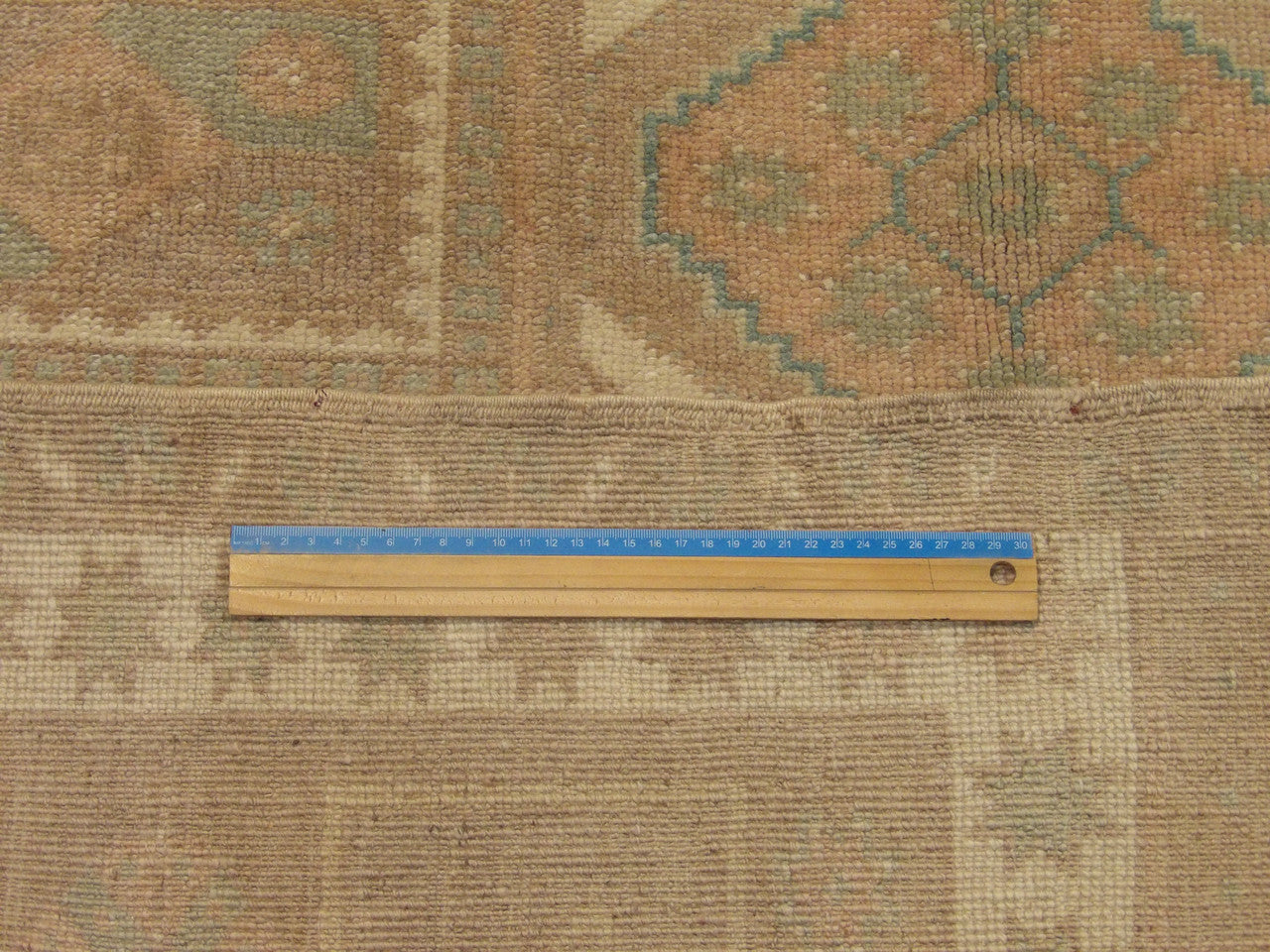 Brown & Pink Anatolian Vintage Oushak rug in room setting