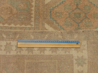 Brown & Pink Anatolian Vintage Oushak rug in room setting