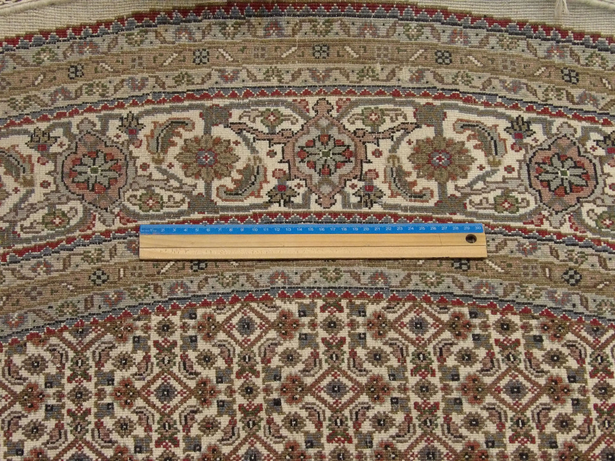 Beige Fine Persian Mir Bidjar rug in room setting