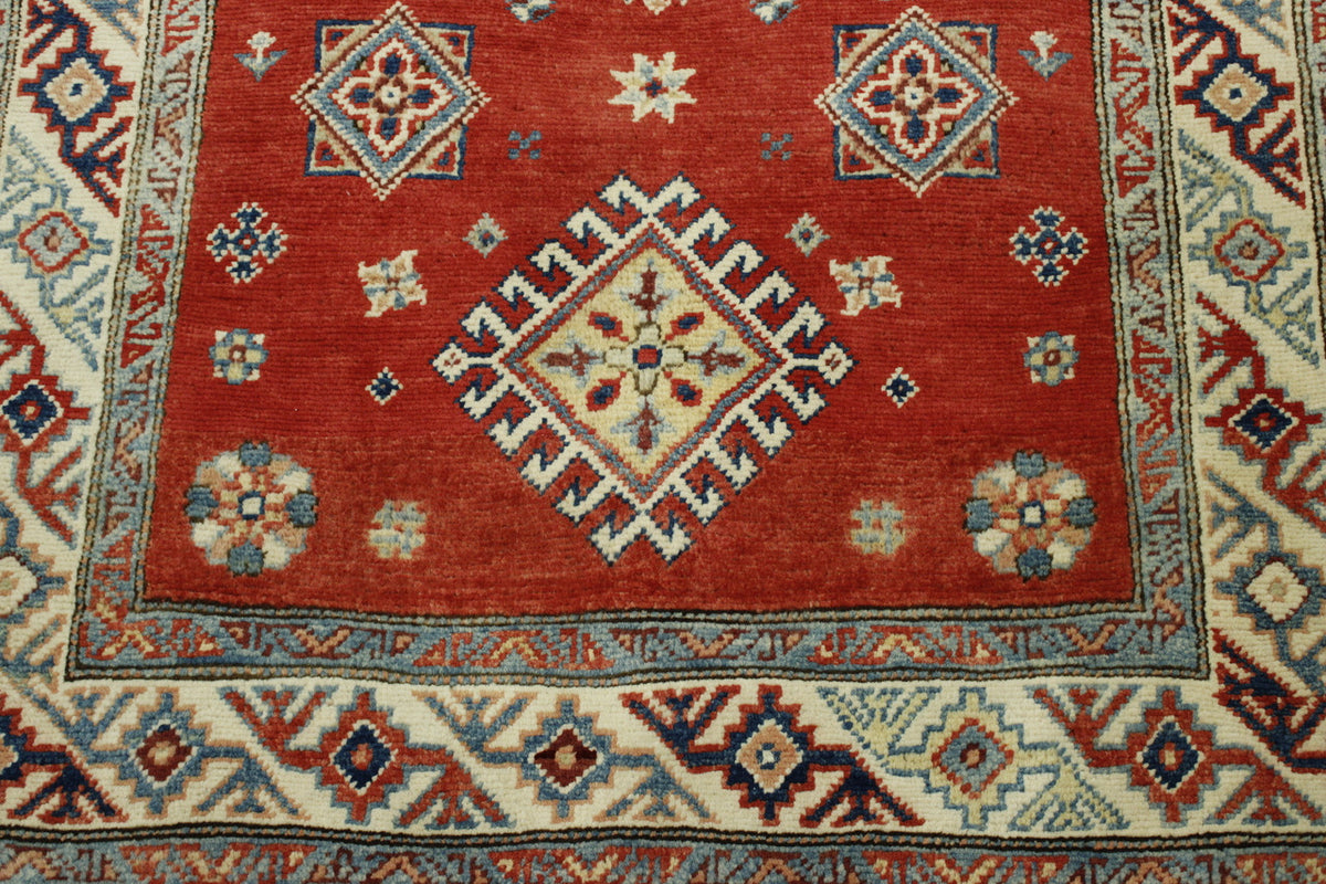 Tribal Super Kazak rug corner detail