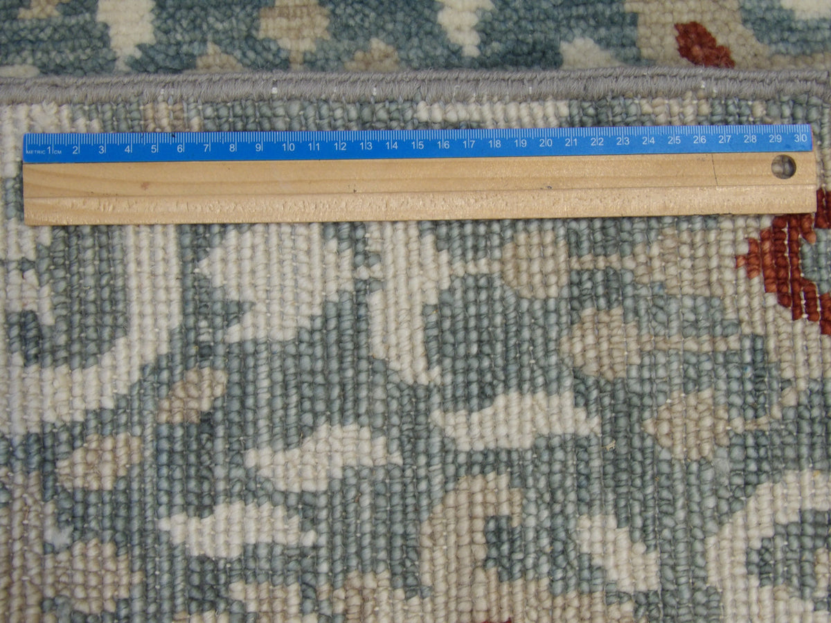Blue and red Ikat rug in room setting