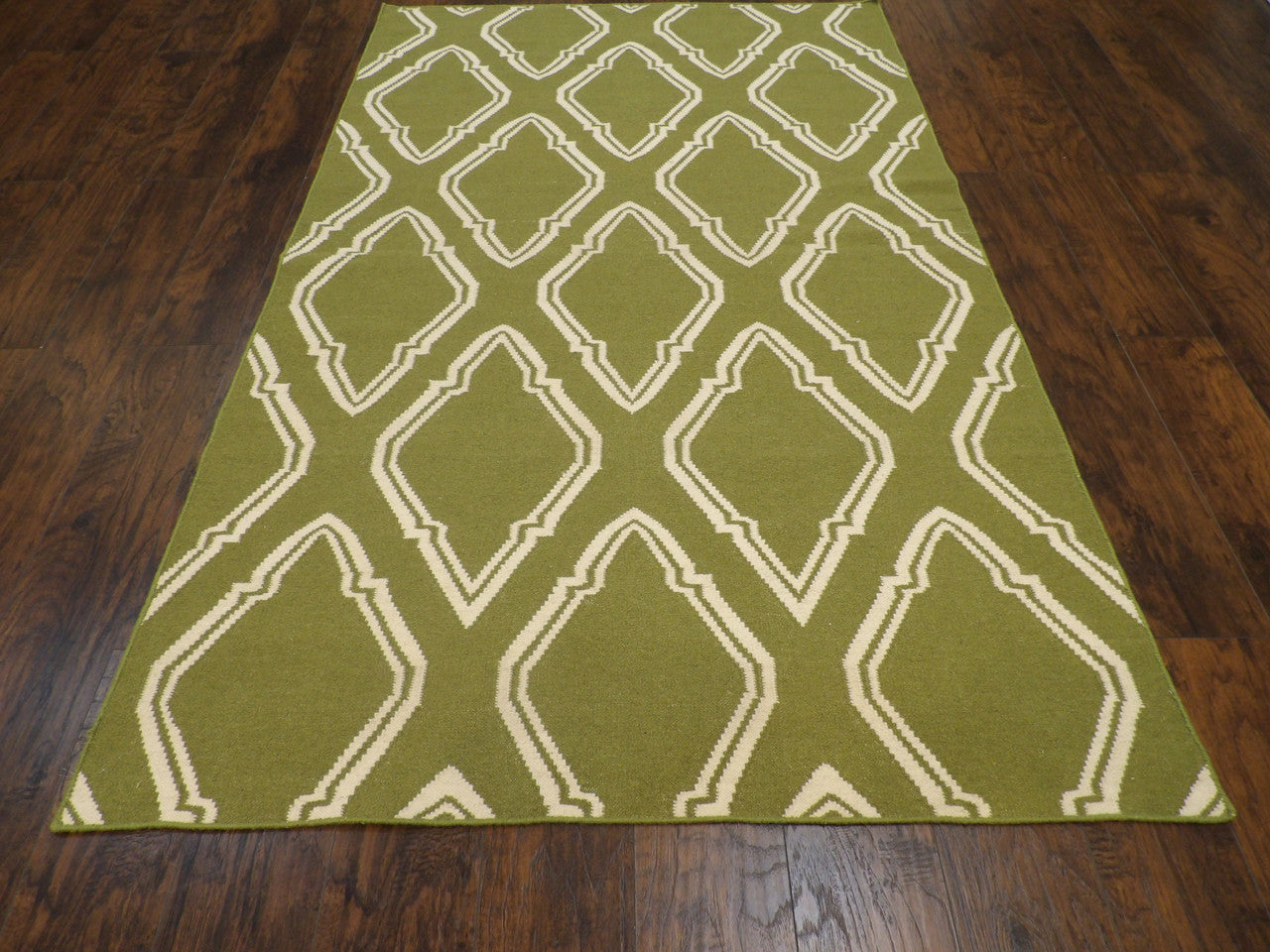 Close-up of wool pile, Green & Beige rug