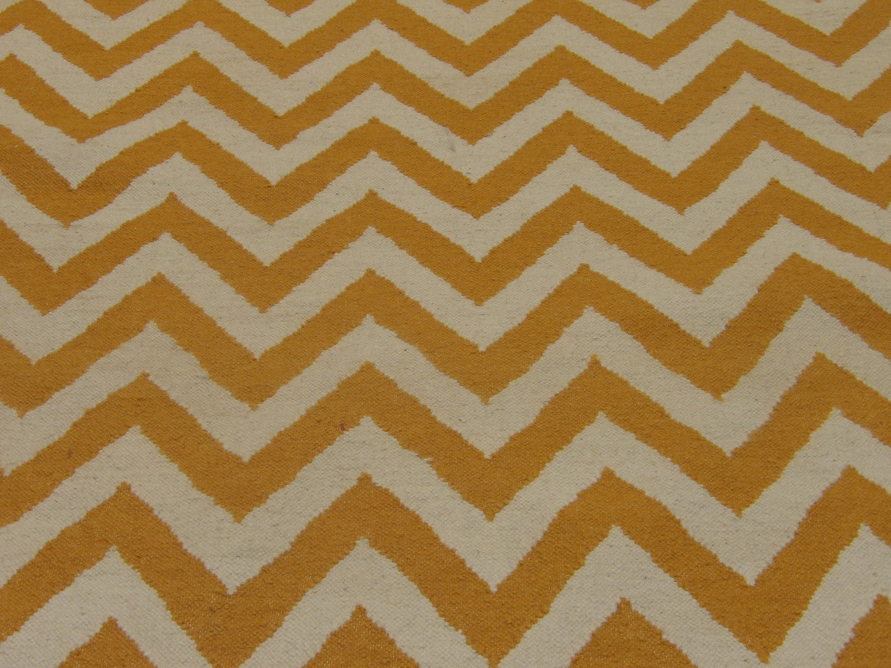 Coastal flatweave wool texture close-up, gold