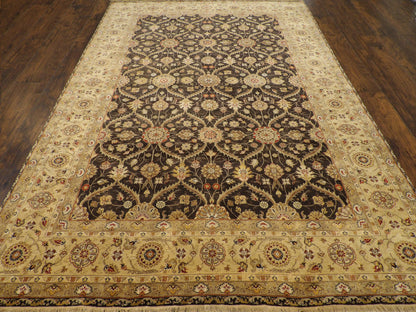 Close-up of wool-silk pile, black and gold rug