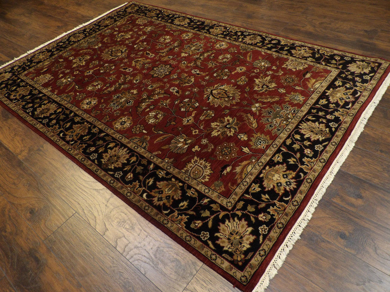 Kashan medallion pattern detail, black and red antique wash rug
