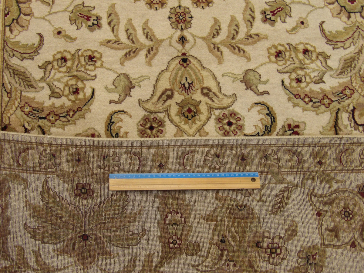 Beige Ziegler rug in room setting