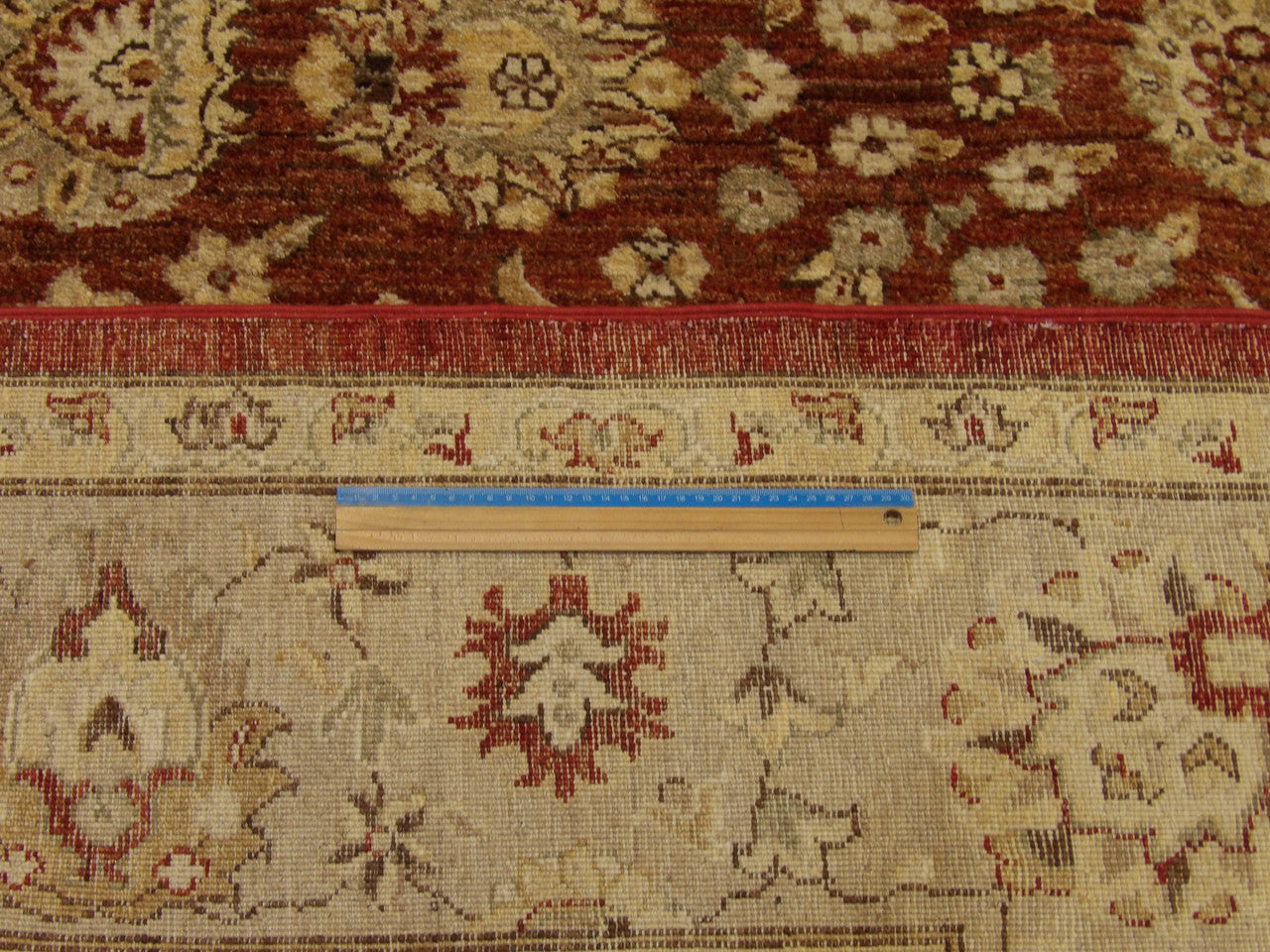 Gold and rust Oushak rug in room setting