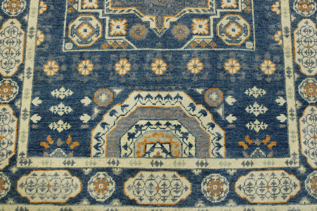 Blue & Beige Tribal Super Kazak rug in room setting