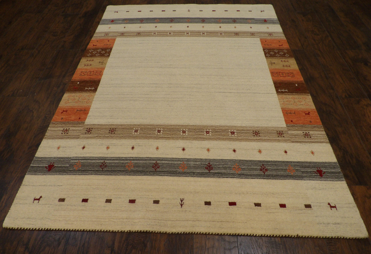 Close-up of wool pile, ivory and rust rug
