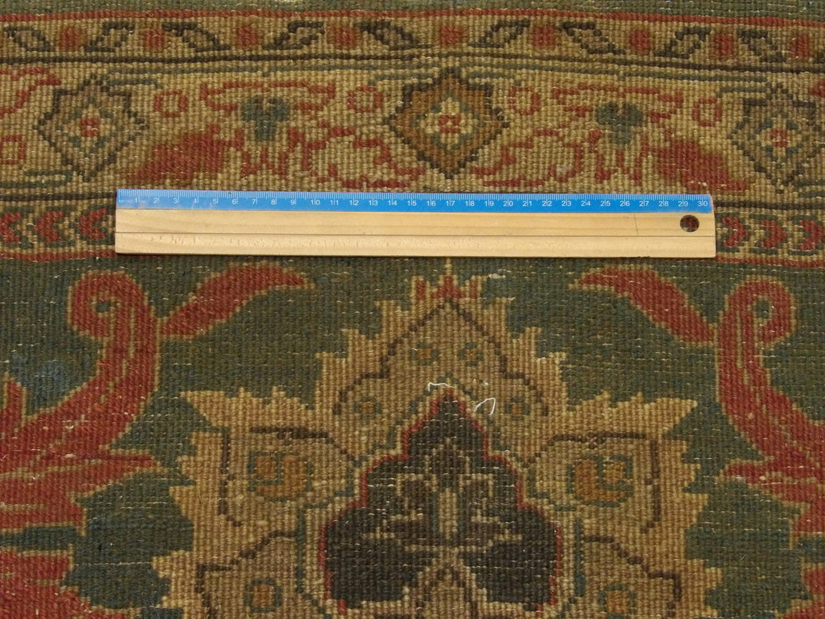 Gold and green Ziegler runner in hallway setting