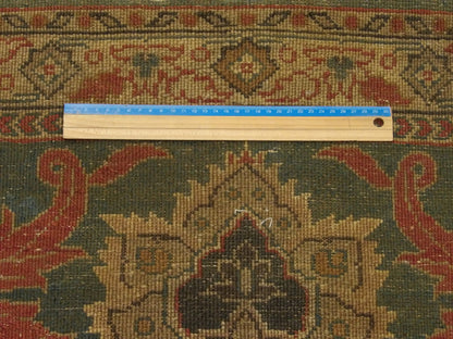 Gold and green Ziegler runner in hallway setting