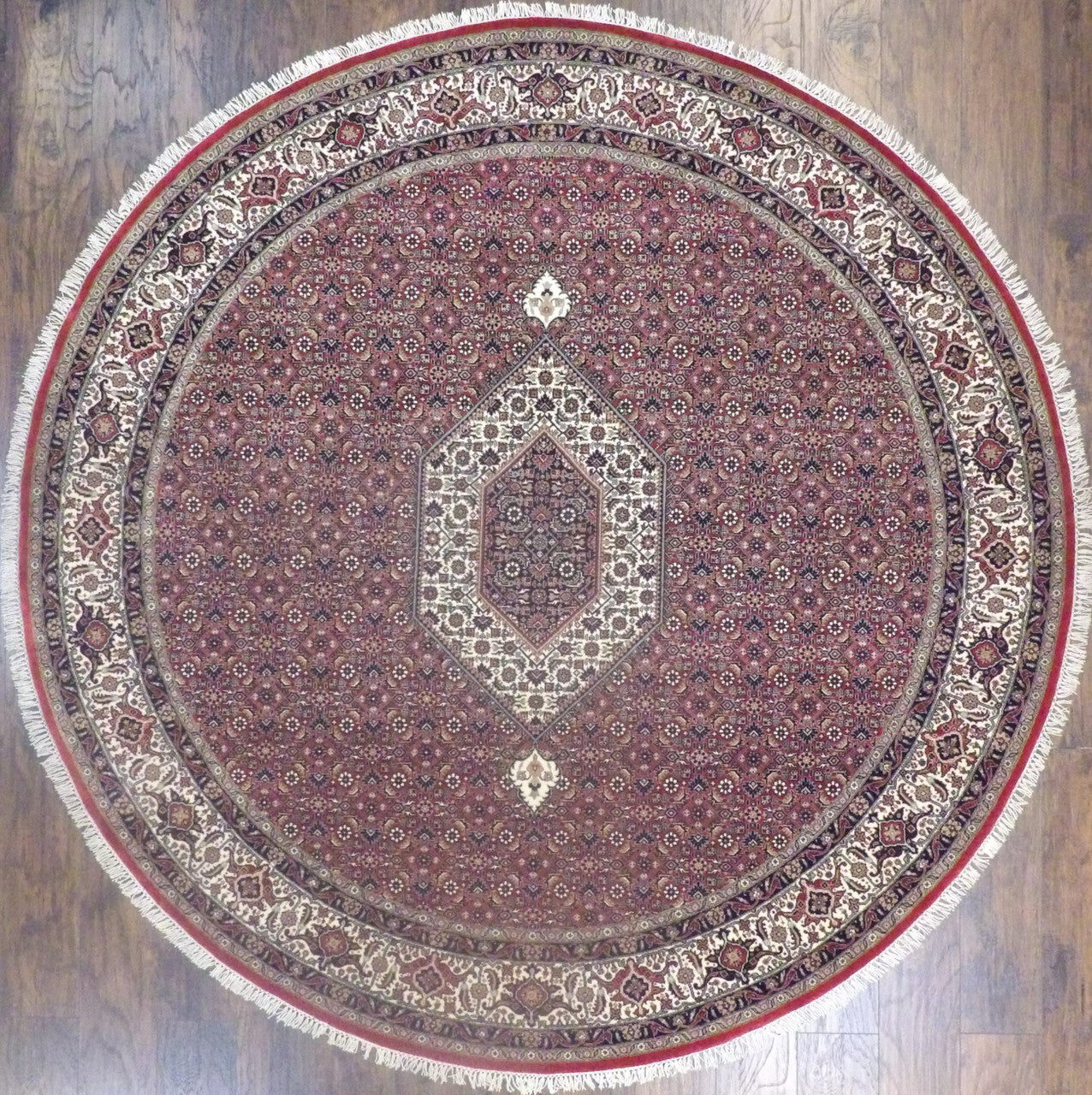 Fine Persian Mir Bidjar hand-knotted wool round rug in beige and red, full view