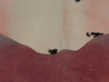 Full room view of Brazilian cowhide rug in pink