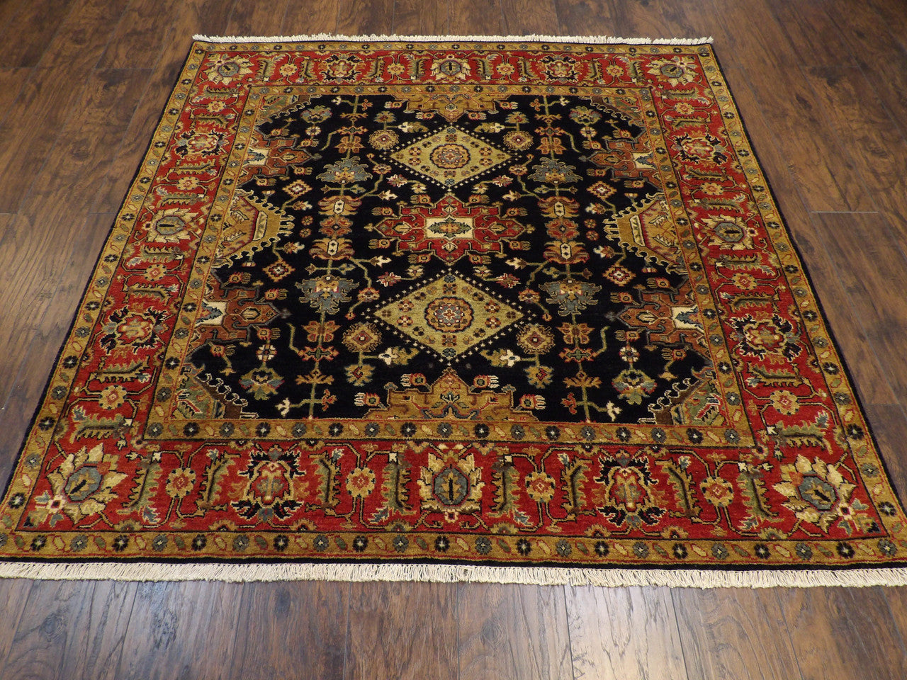 Close-up of hand-knotted wool pile on Sherapi tribal area rug