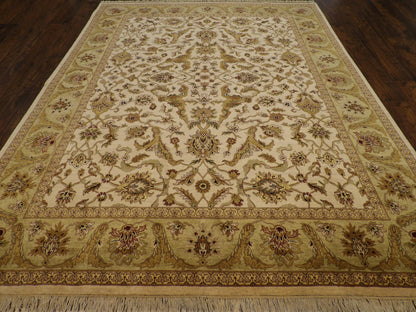 Close-up of wool pile, green and beige rug