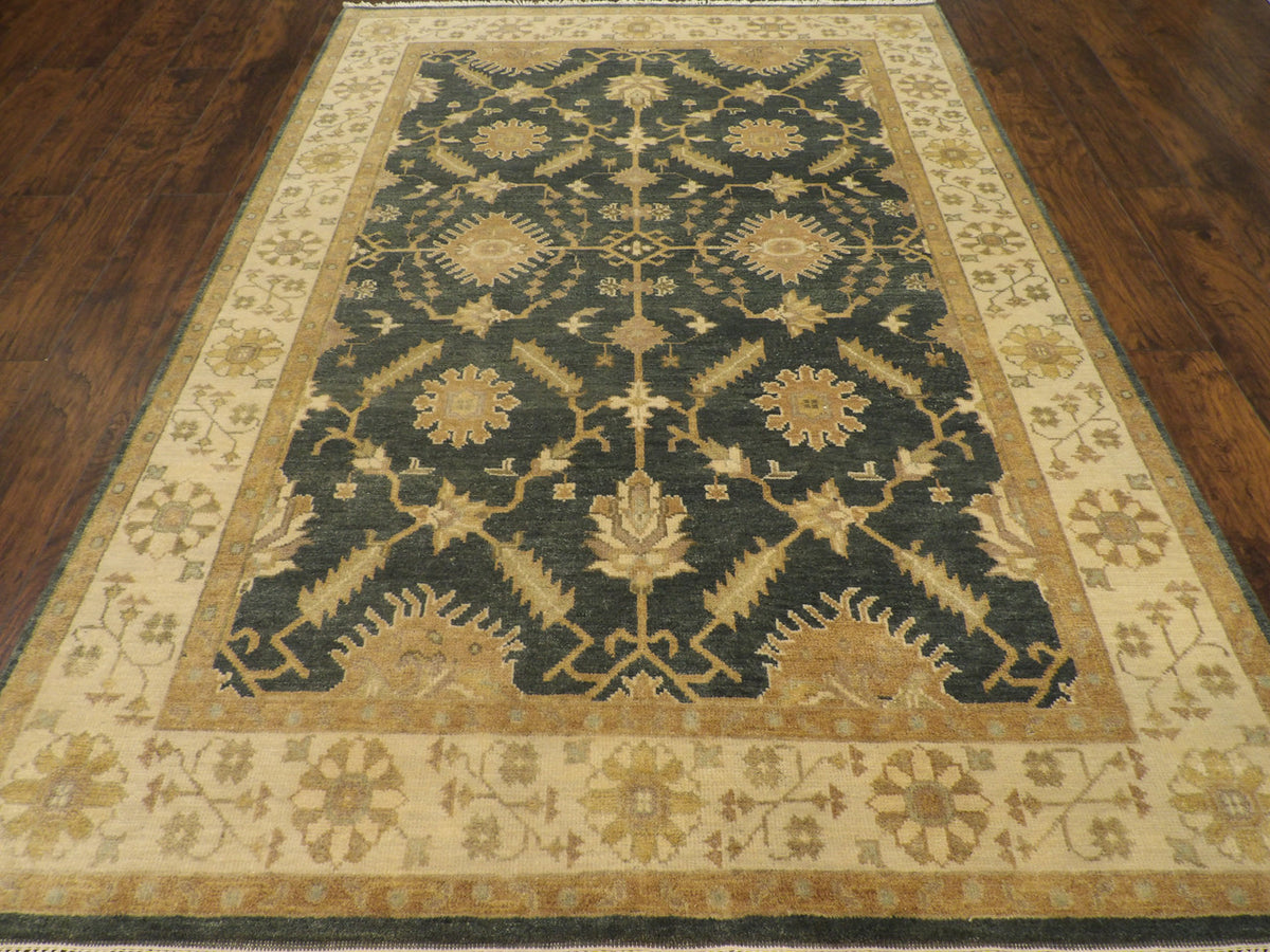 Close-up of wool pile, green and beige rug