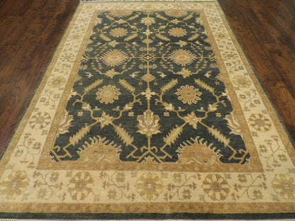 Close-up of wool pile, green and beige rug