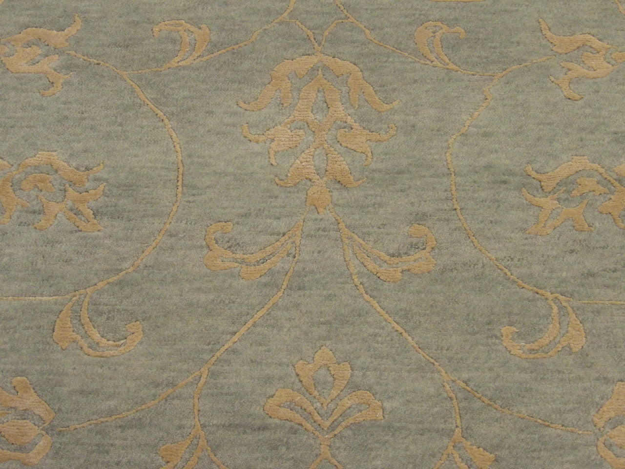 Transitional leaves rug border detail, blue and gold