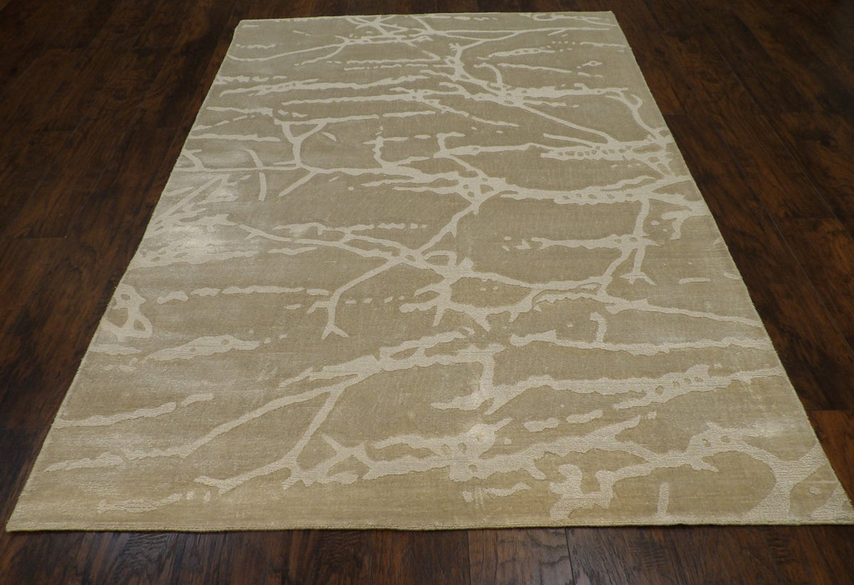 Close-up of looped wool-silk texture, green and gray rug