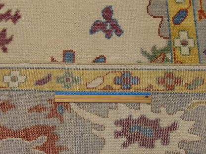 Full room view of colorful Turkish Oushak hand-knotted rug