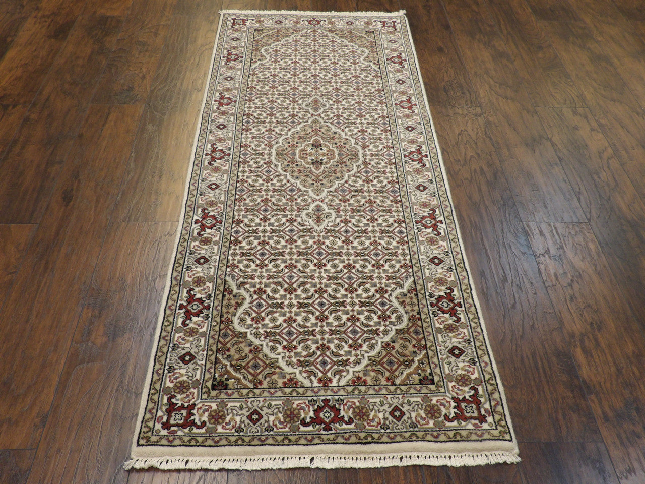 Ivory Persian Mahi Tabriz rug in room setting