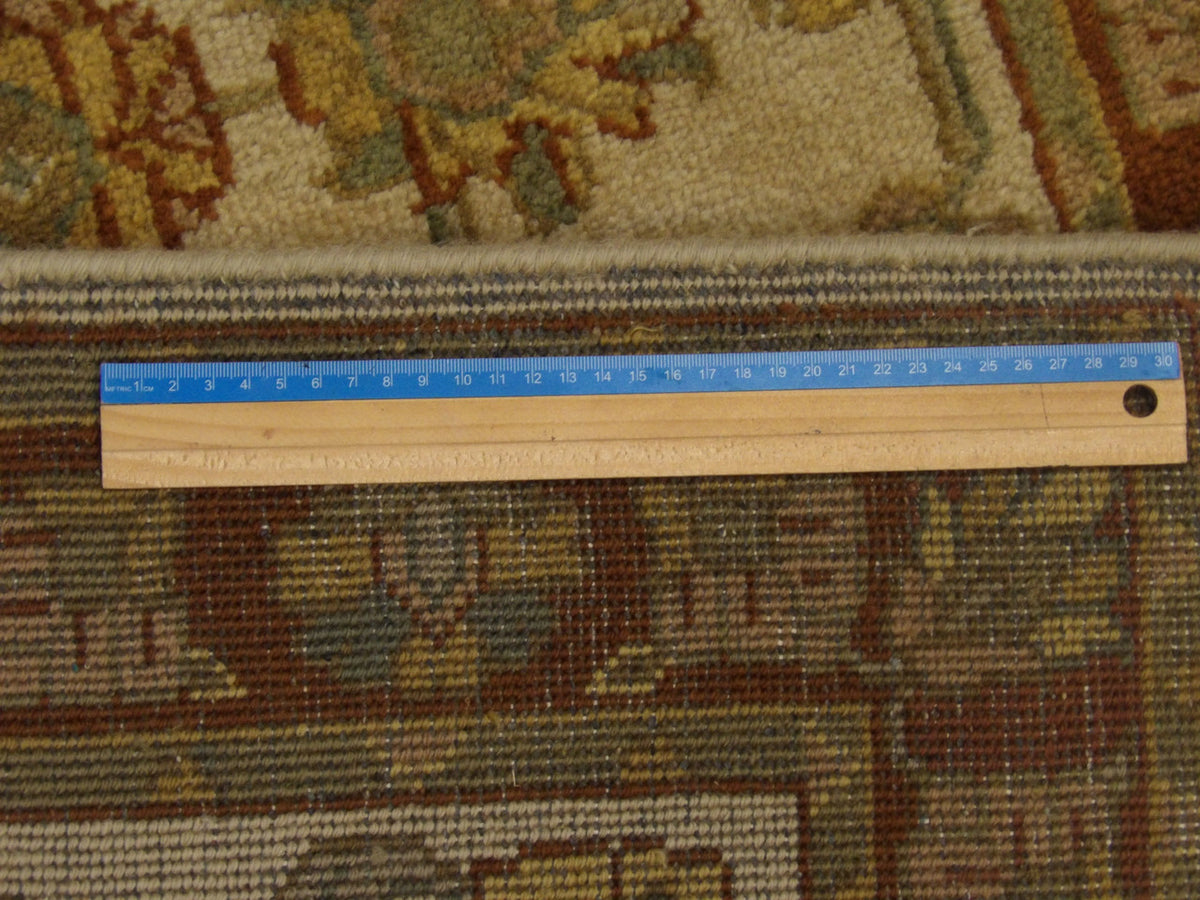 Brown & Beige Persian Kashan rug in room setting