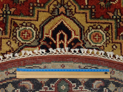 Blue and red Heriz round rug in room setting
