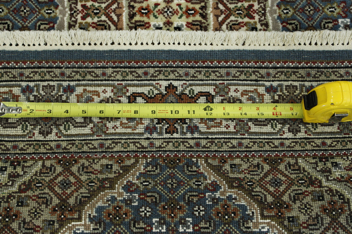 Blue & Beige Traditional Tabriz rug in room setting