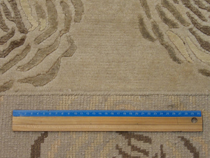 Brown and beige rose rug in room setting