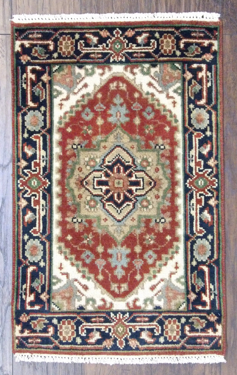 Tribal Heriz hand-knotted wool rug in blue and red, full view