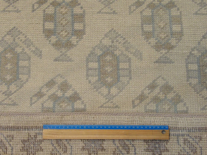 Blue and beige paisley rug in room setting
