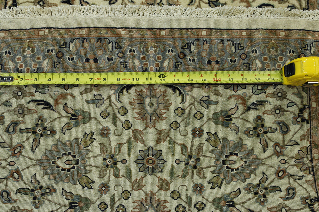 Beige Traditional Fine Herati rug in room setting