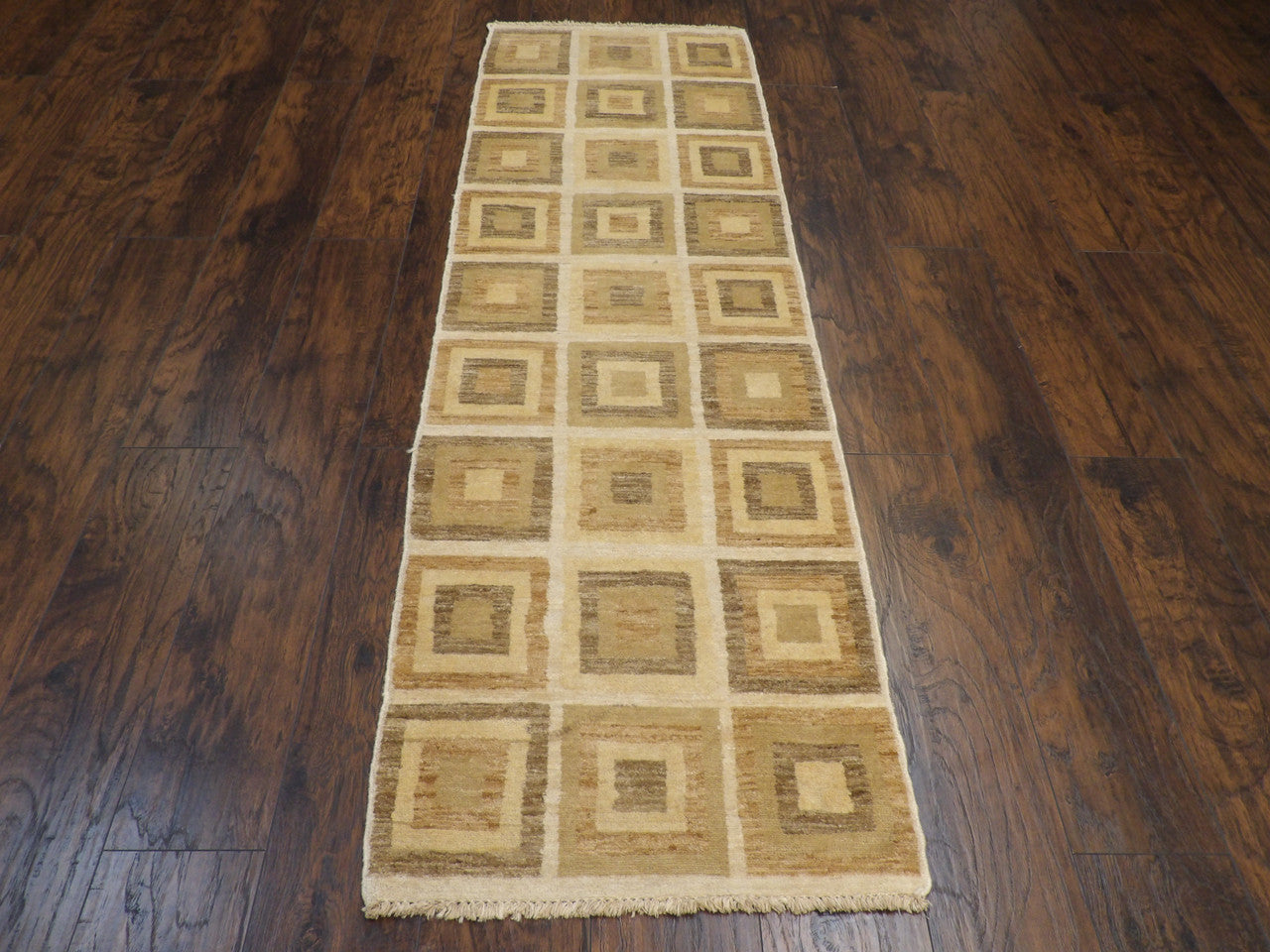 Close-up of wool pile, brown and beige runner